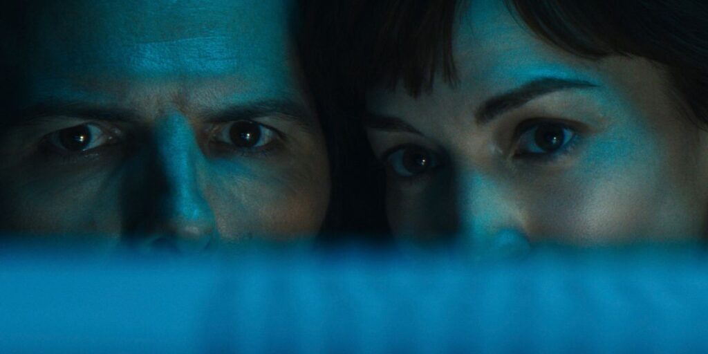 Close up of Adam Scott and Britt Lower's faces side-by-side in Severance