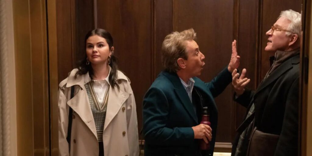 Mable looks bored as Charles and Oliver fight in the elevator in Only Murders In The Building