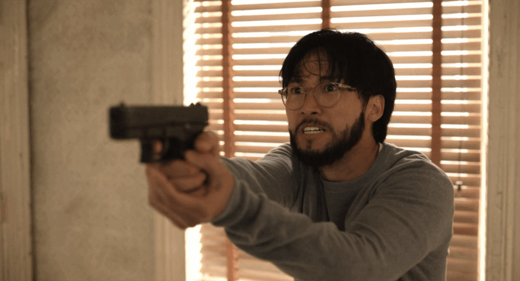 Rex points a gun at Mabel