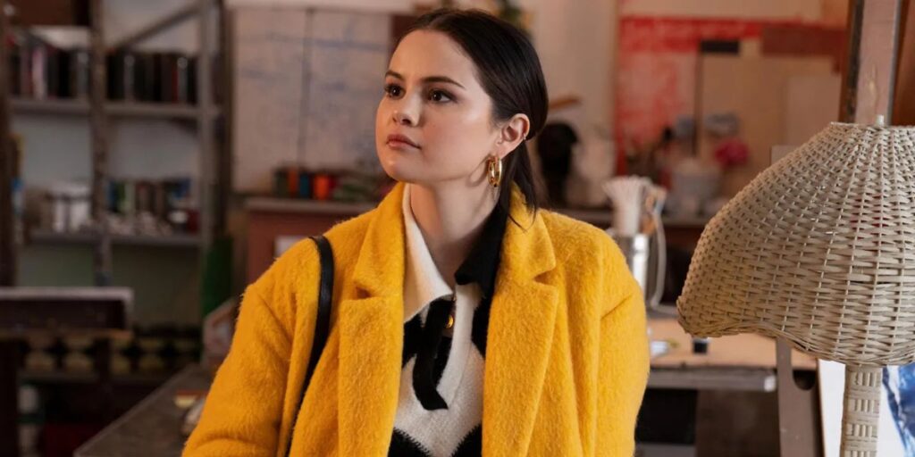 Selena Gomez as Mabel wearing a yellow suit in Only Murders In The Building