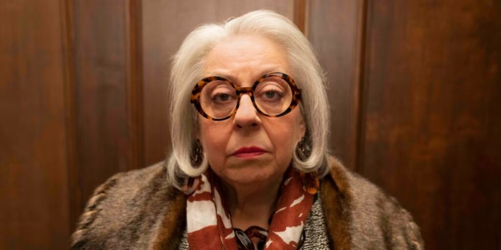 Close up of Jayne Houdyshell as Bunny Folger looking bored in Only Murders In The Building