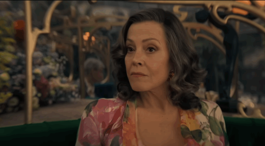 Sigourney Weaver, wearing a floral dress in Dust Bunny. 