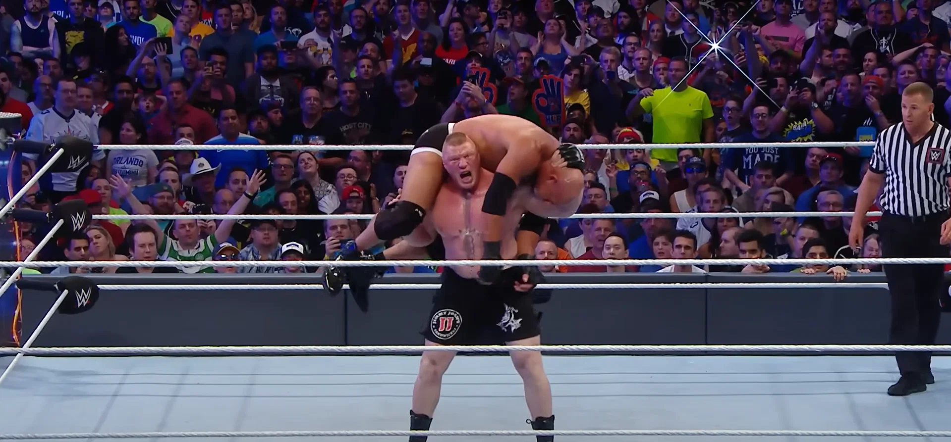 Brock Lesnar about to deliver an F5 to Goldberg