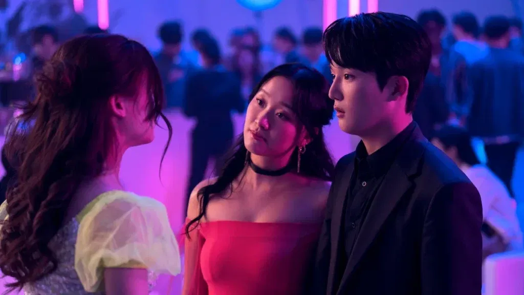 Gia Kim standing beside a man in XO, Kitty