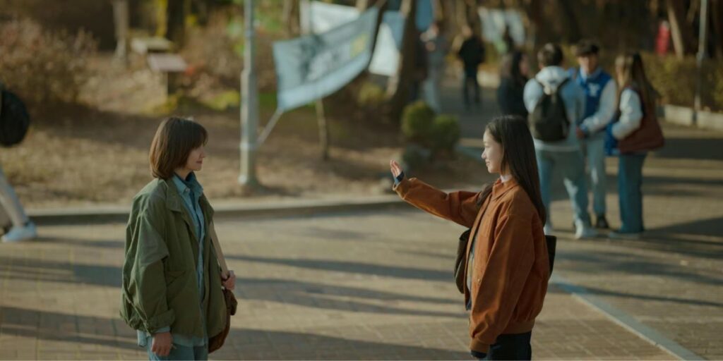 Scene from You and Everything Else with two female characters standing in front of each other