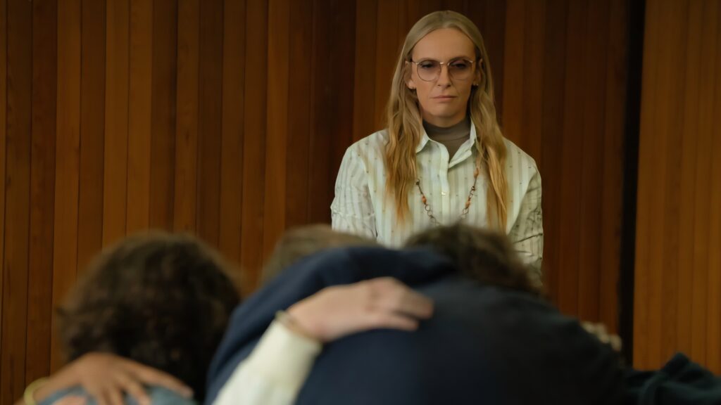 A woman looks over her students