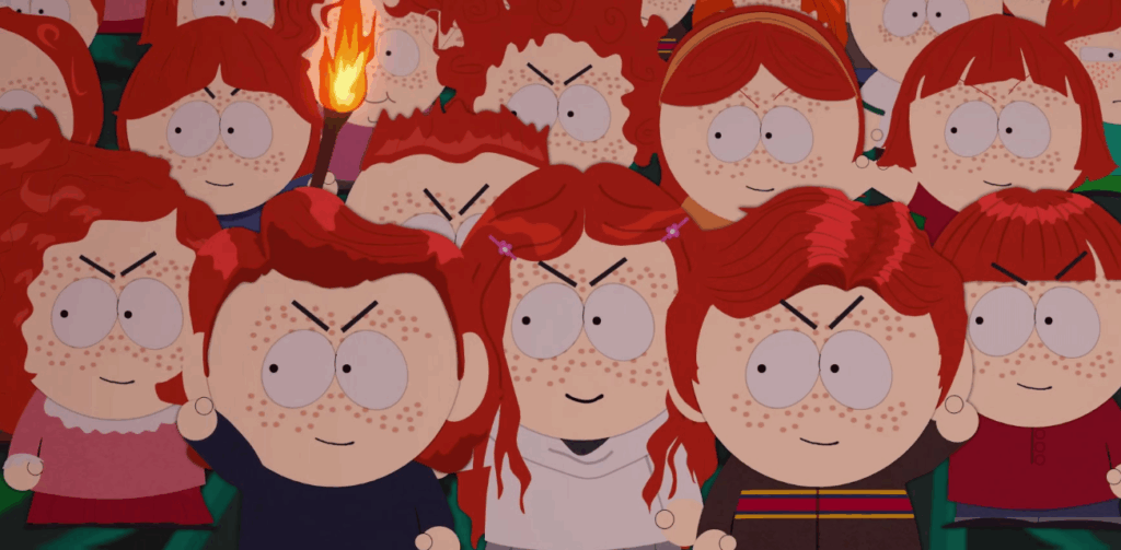 A large group of red-haired characters with freckles, some holding torches, are gathered together with angry expressions on their faces.