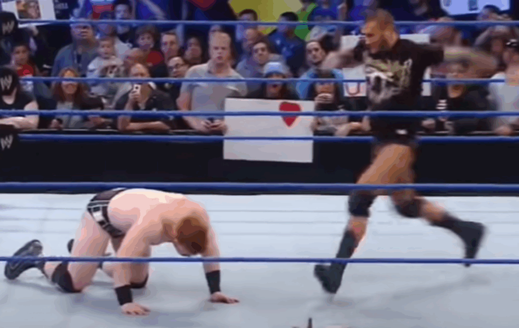 Randy Orton about to punt kick Sheamus