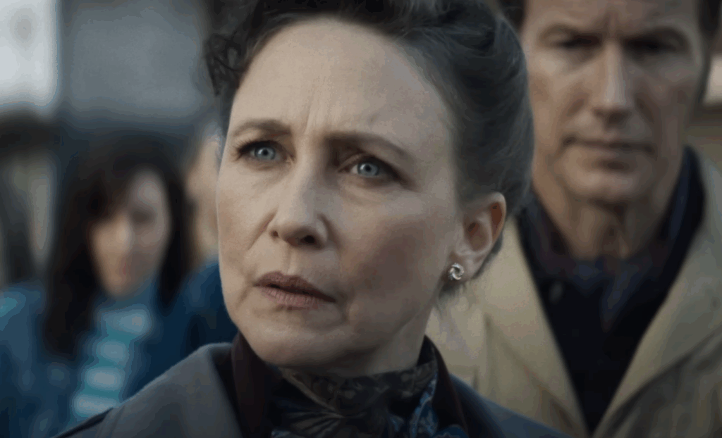 Lorraine Warren being approached by the media in The Conjuring: Last Rites.