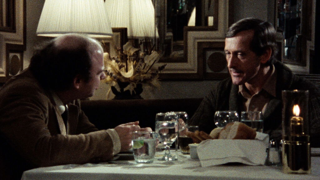 Two characters chatting over dinner in My Dinner With Andre