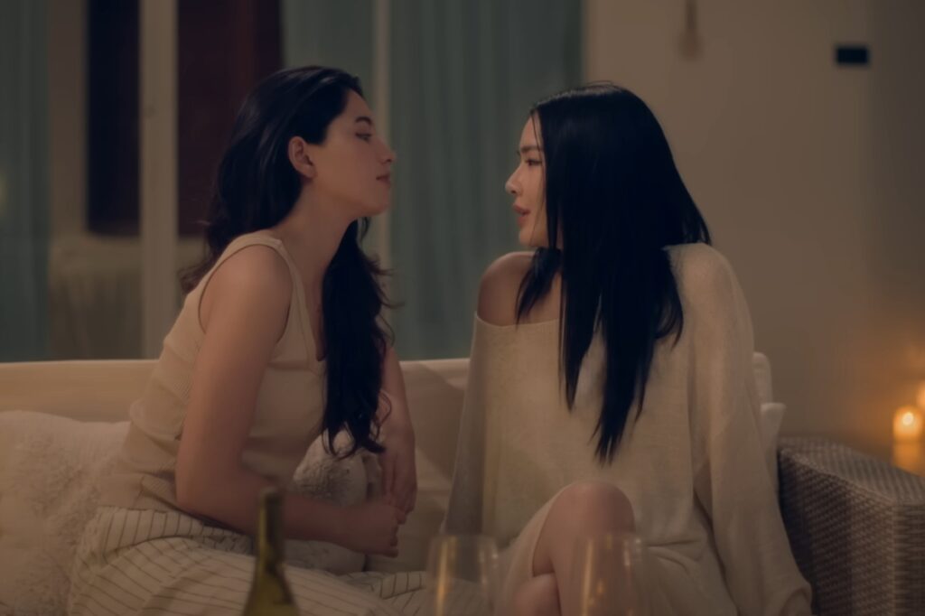 Two women sitting on a couch
