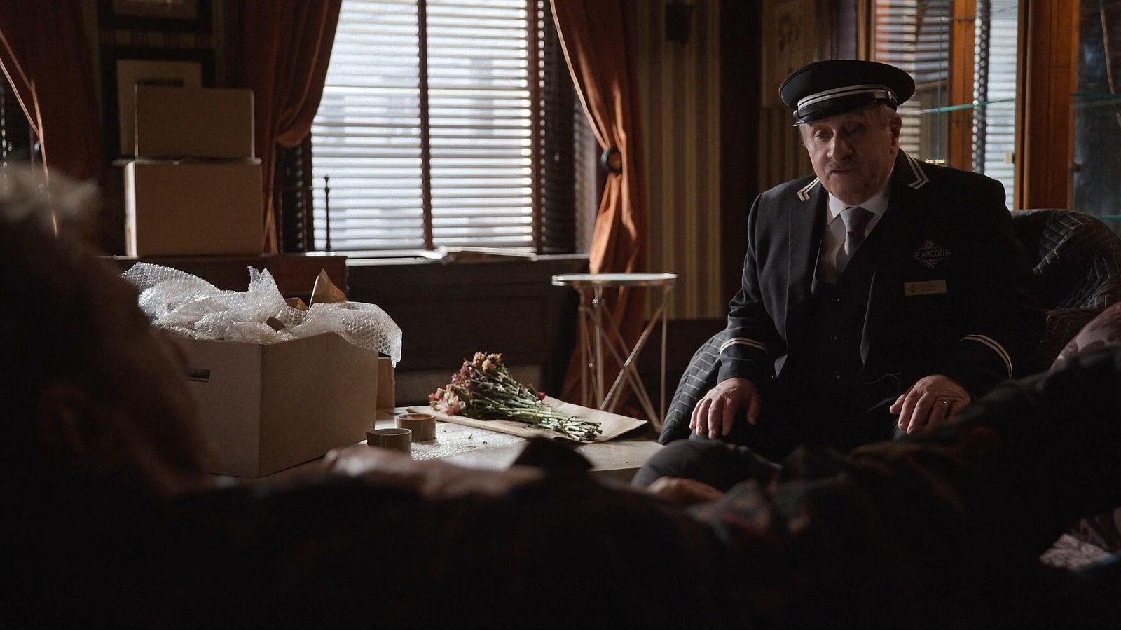 Lester talking to Oliver who's laying down.