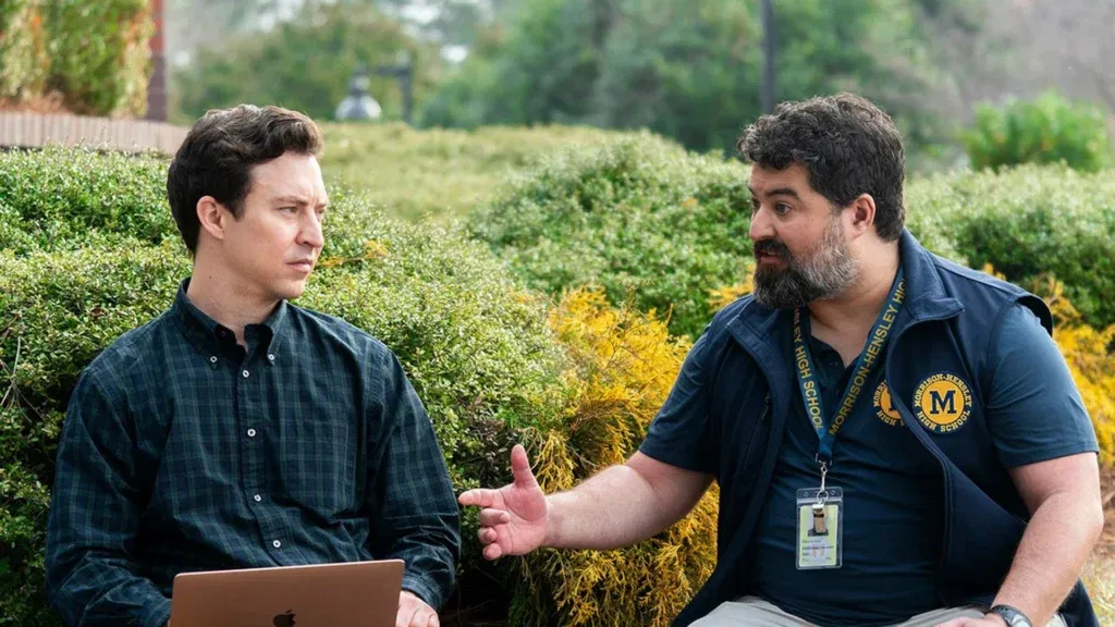 Two guys speaking in the garden