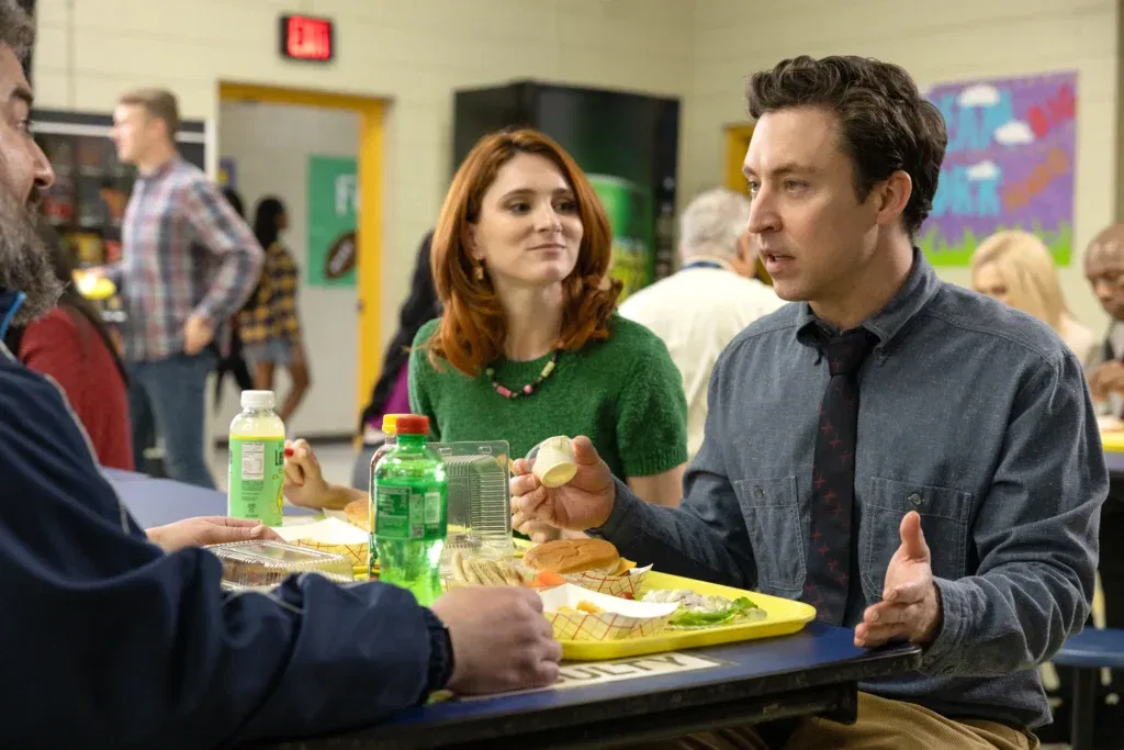 Three people chatting over lunch
