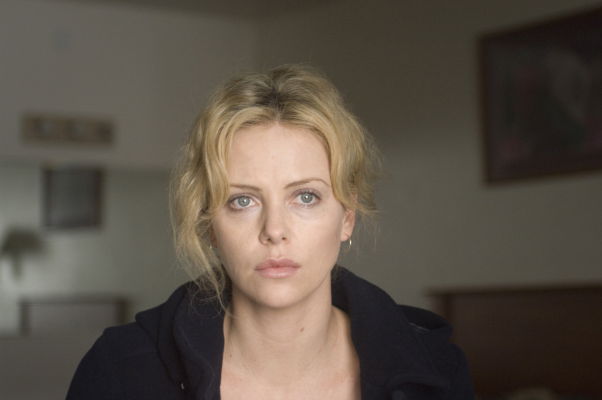 Theron looks at the window