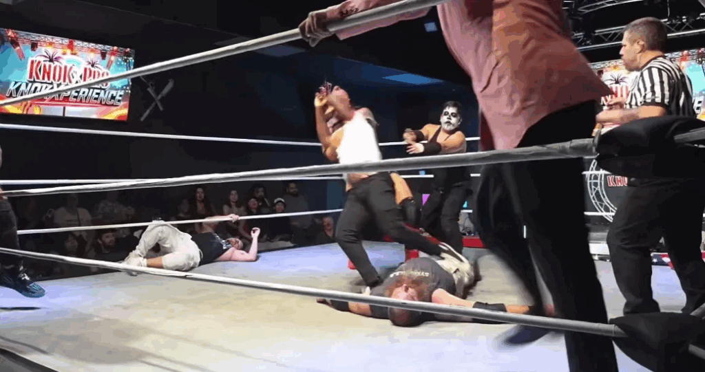 Raja Jackson being backed off by other wrestlers