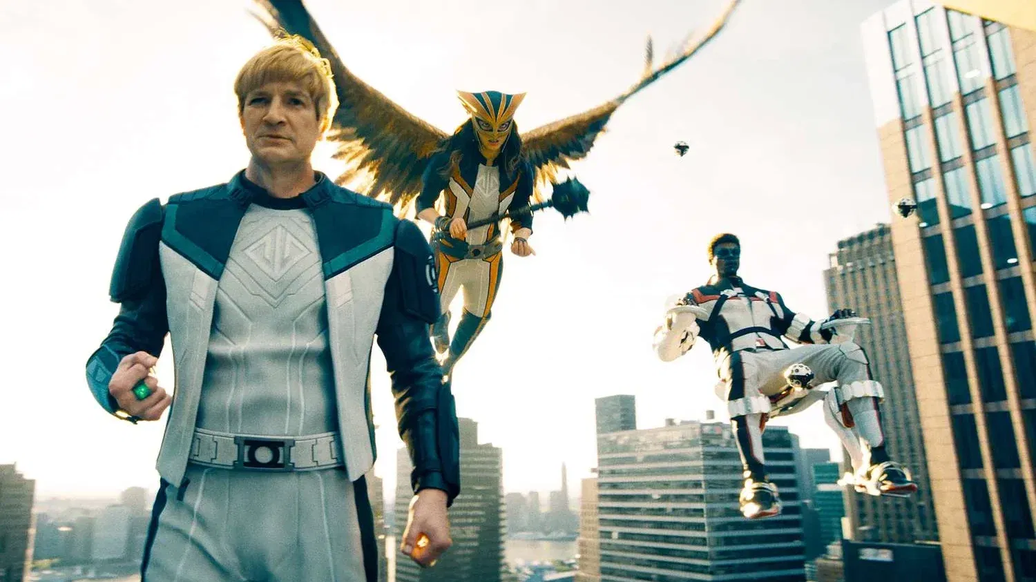 Guy Gardner, Hawkgirl, and Mr. Terrific floating and looking down in Superman