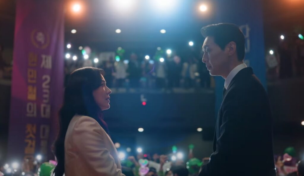 A man and a woman standing facing each other