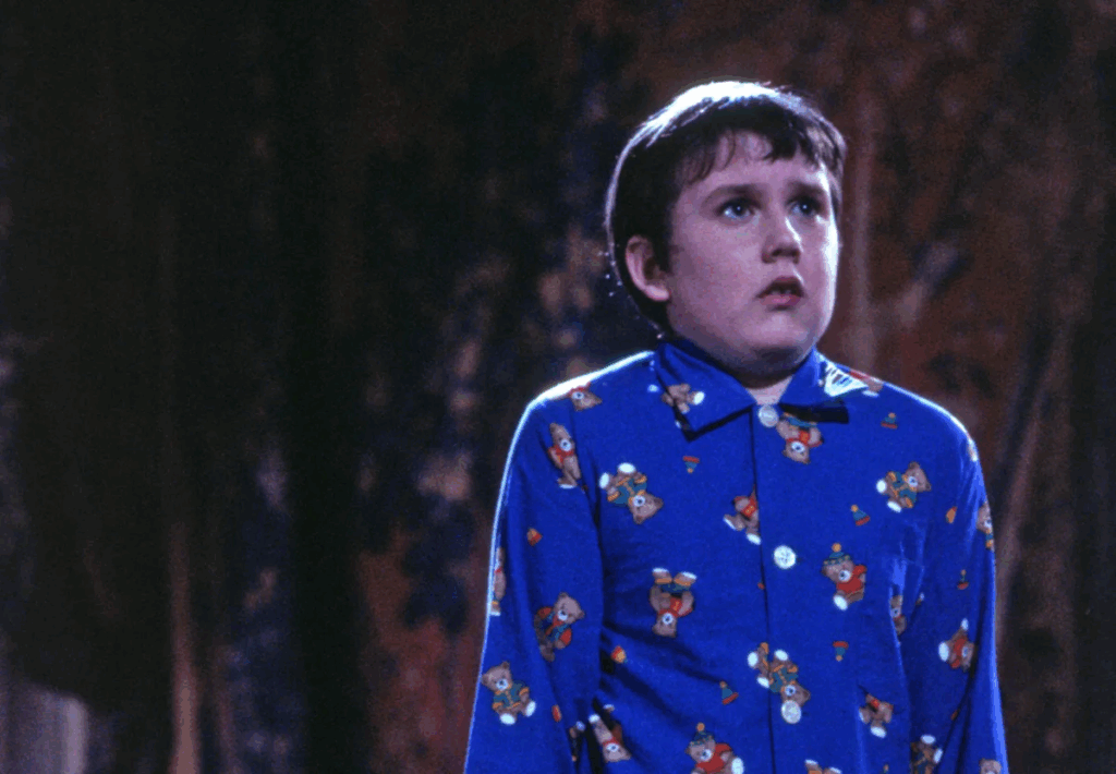 Neville looking still after being petrified by Hermione.