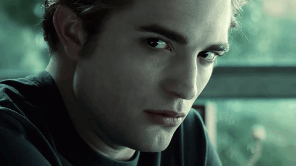 Edward Cullen (Robert Pattinson) in profile with an intense, brooding expression in a still from the first Twilight movie.