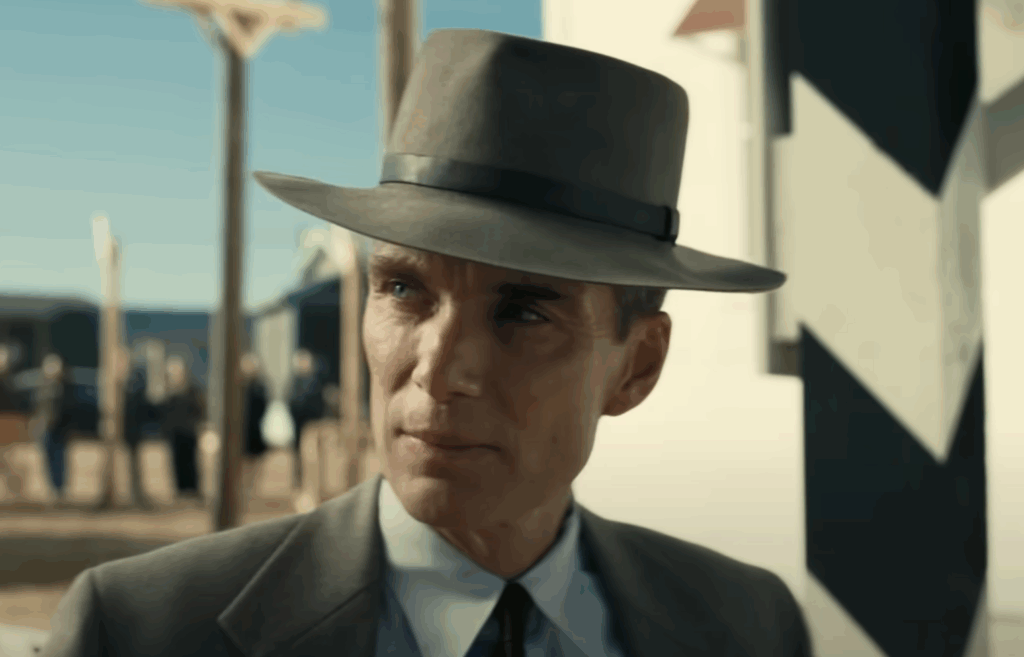 Cillian Murphy with wearing a hat and a suit as Oppenheimer. 