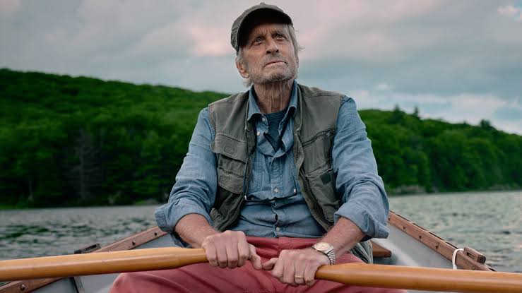 An old man rows a boat