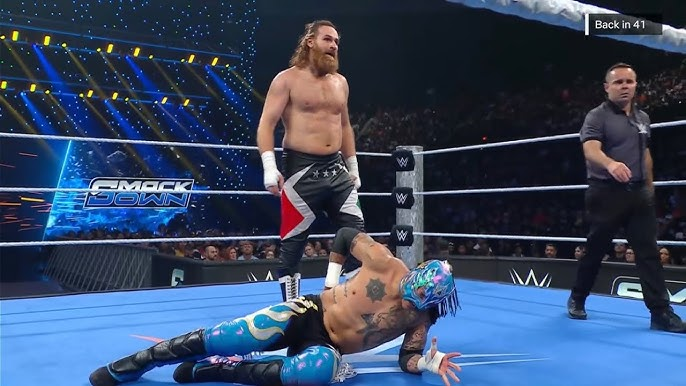 Sami Zayn and Rey Fenix during their match