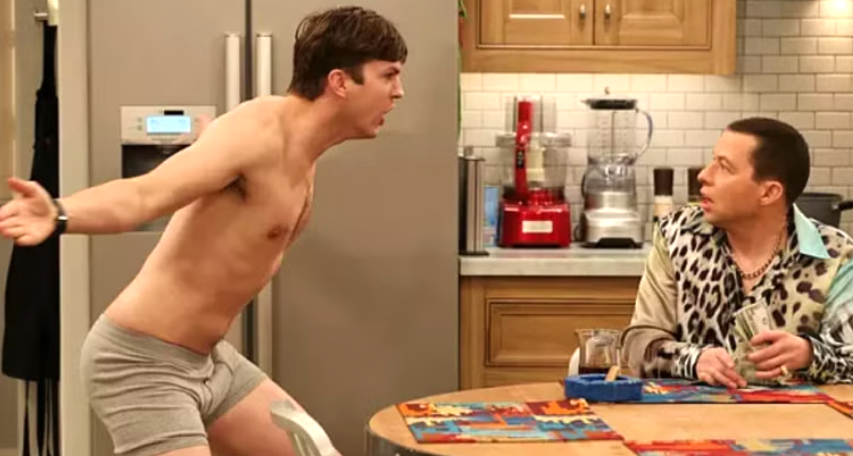 Walden Schmidt is shirtless and in his underwear, yelling at Alan Harper in a kitchen.
