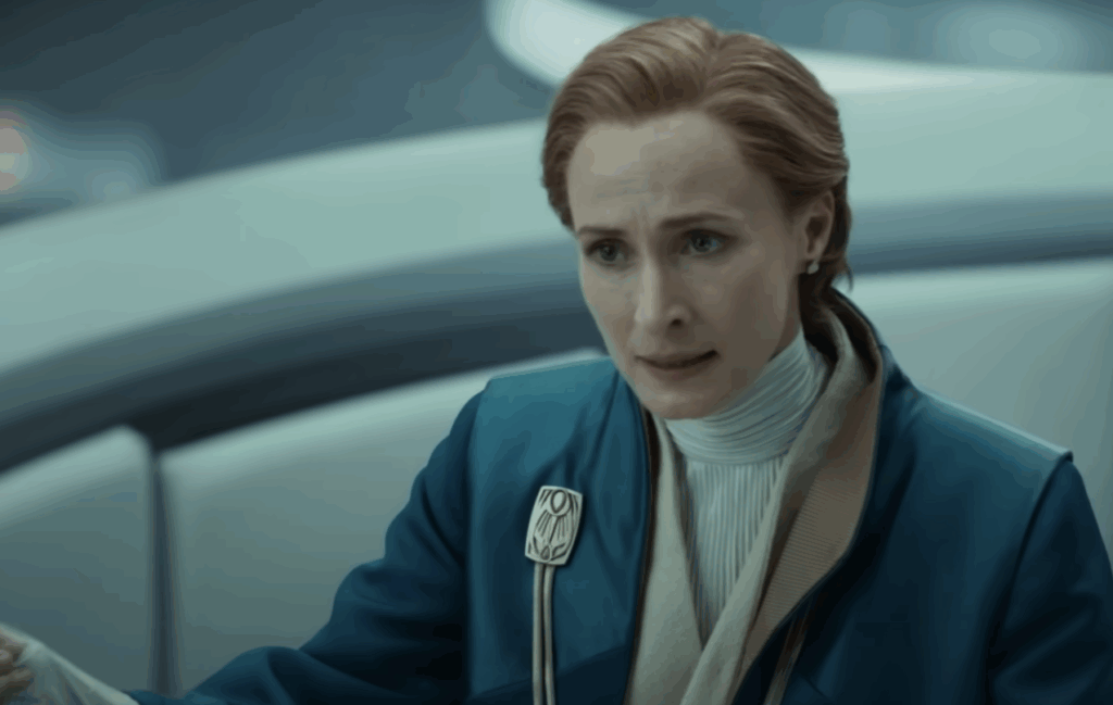 Genevieve O’Reilly wearing a blue suit during her Senate speech in Andor.