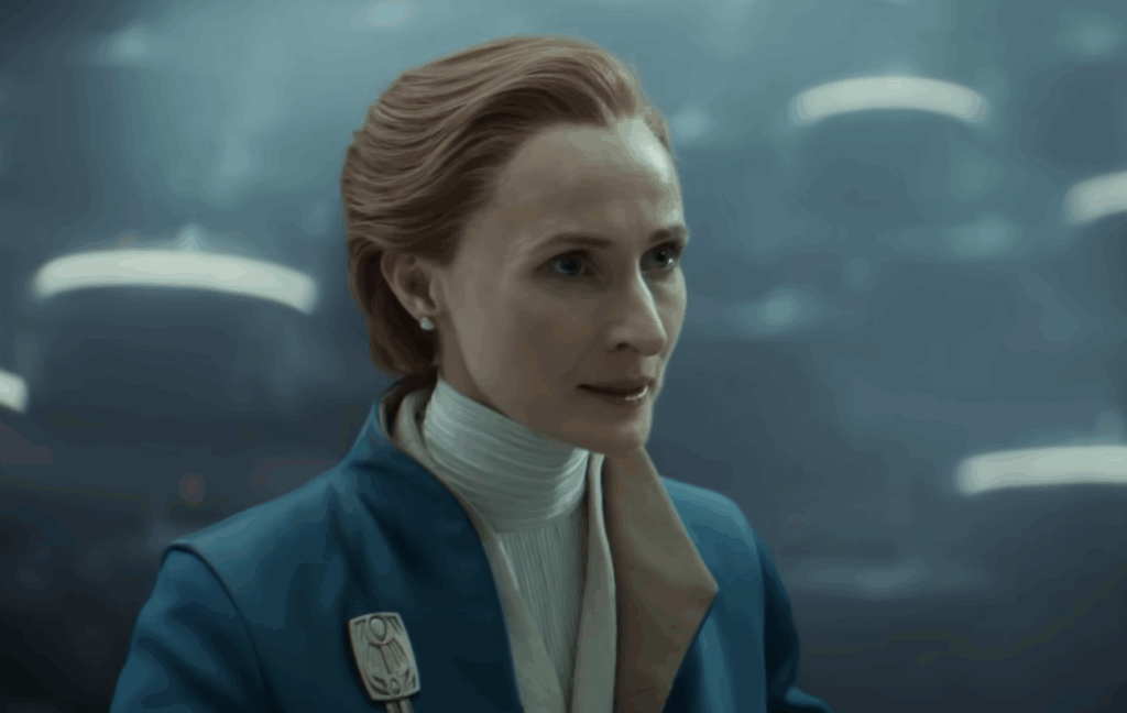 Genevieve O’Reilly wearing a blue suit during her Senate speech in Andor.