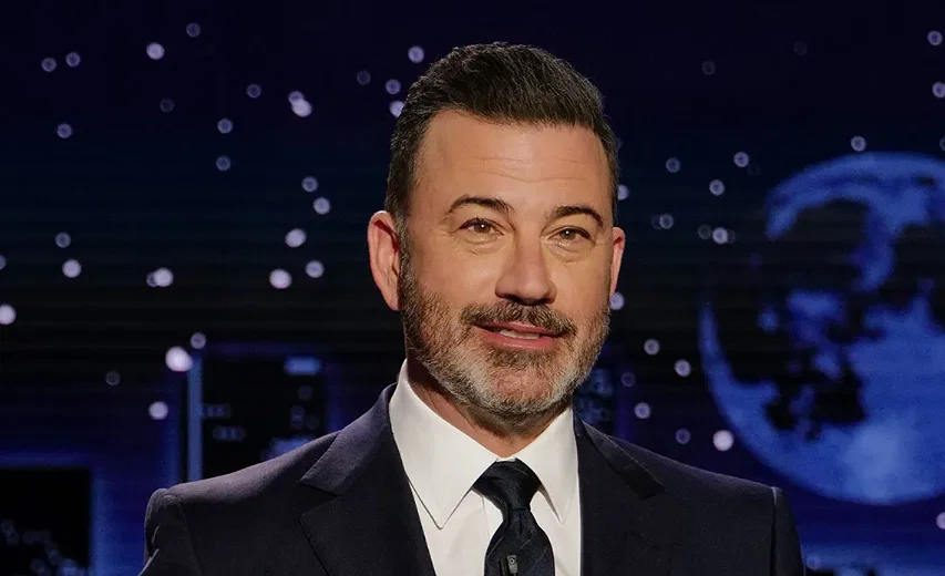 Jimmy Kimmel is looking directly at the camera.