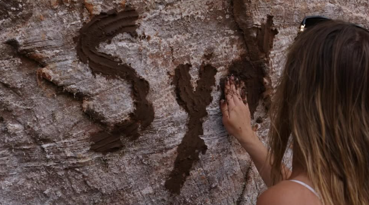 Sydney Sweeney writes on the stony walls