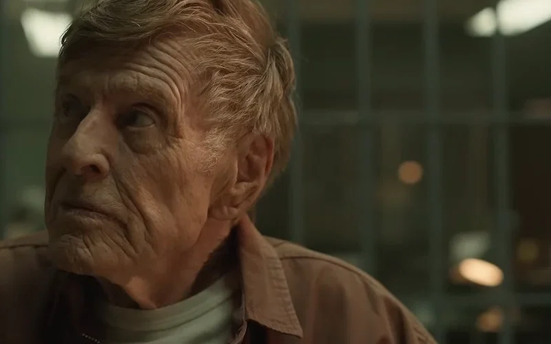 Robert Redford looking to his right with an incredulous look in Dark Winds