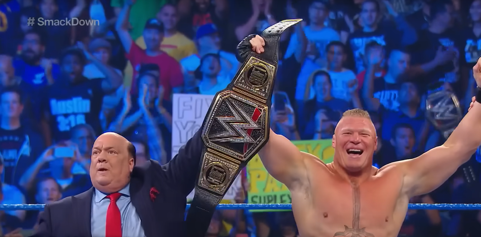 Paul Heyman with Brock Lesnar after his WWE Championship win against Kofi Kingston (October 4, 2019)