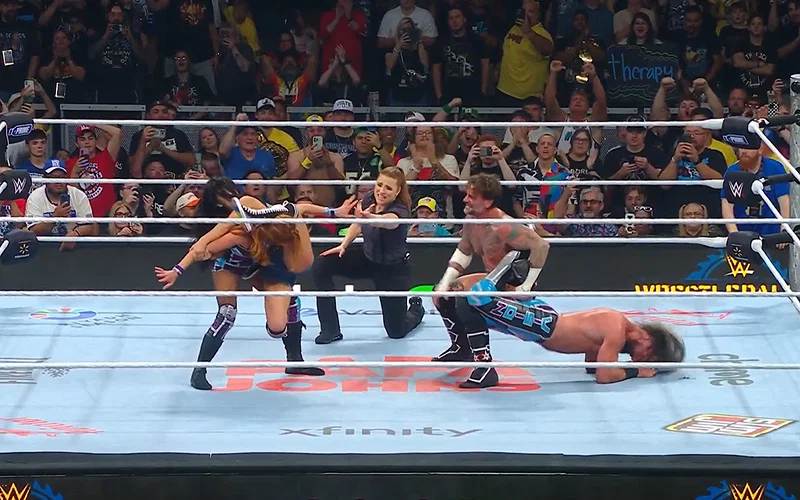 AJ Lee with The Black Widow submission move on Becky Lynch and CM Punk with the Sharpshooter submission move on Seth Rollins at WWE Wrestlepalooza (September 20, 2025)