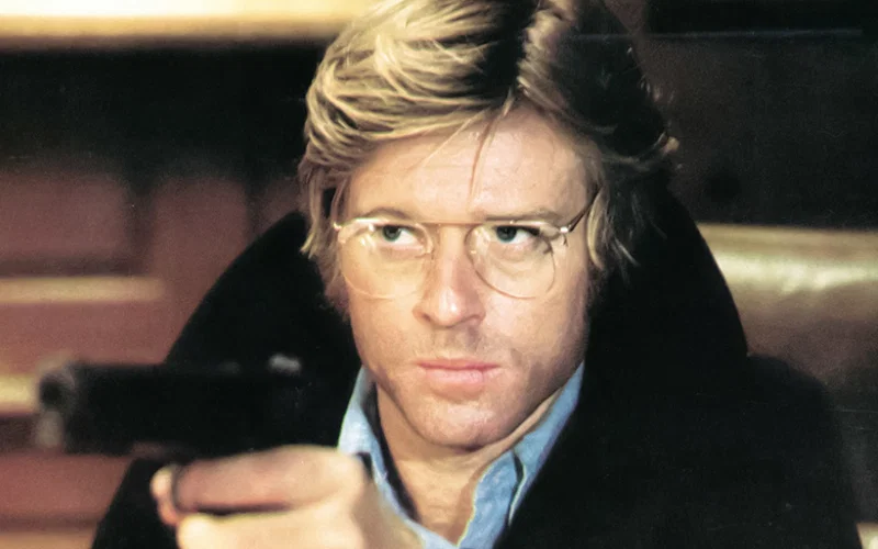 Robert Redford holding a gun in Three Days Of The Condor