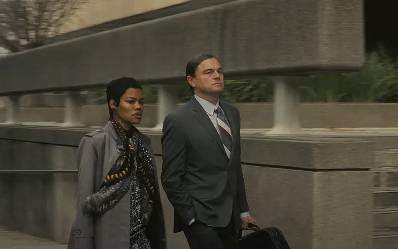 Teyana Taylor and Leonardo DiCaprio wearing formal attires in One Battle After Another.