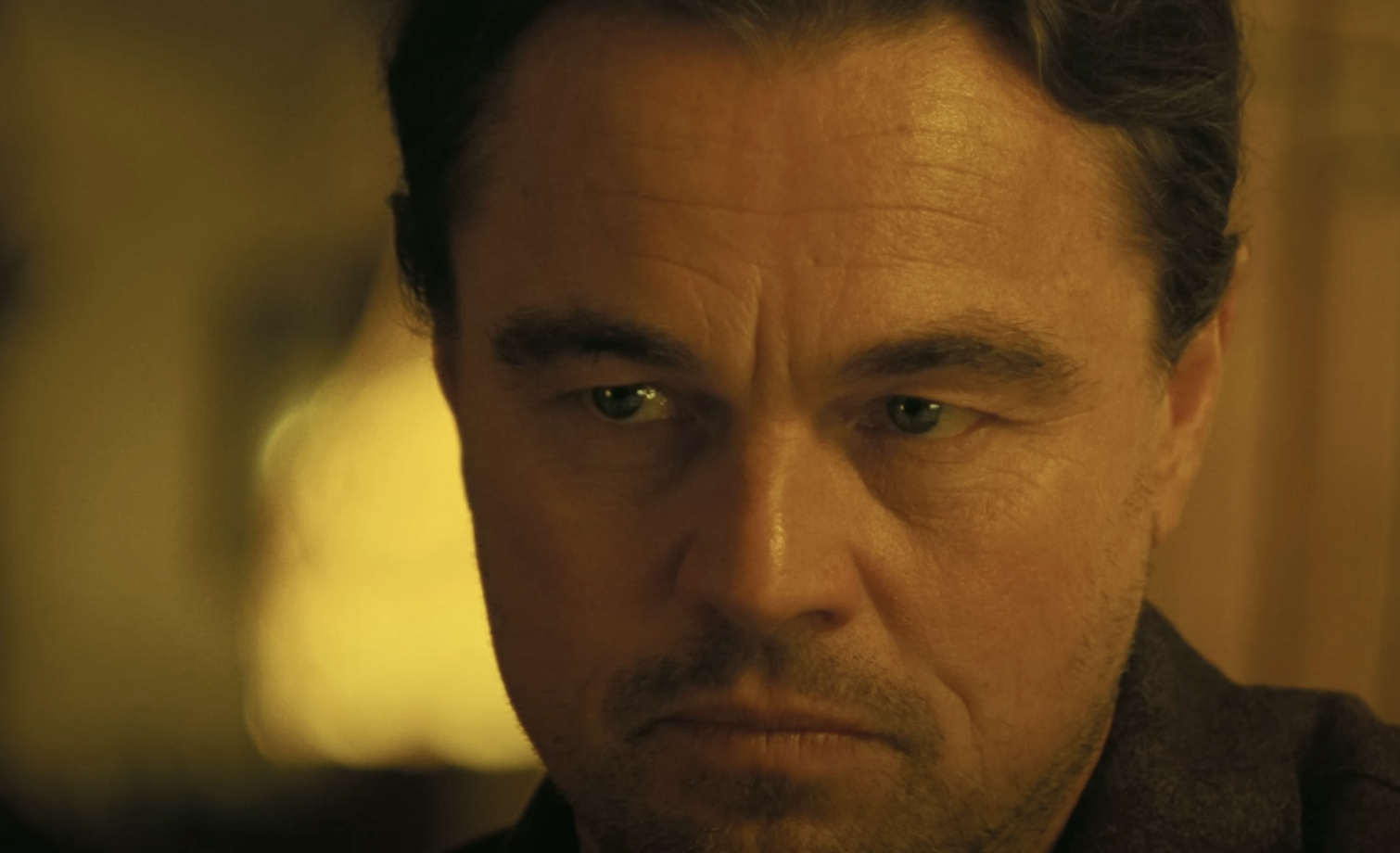 A close-up shot of Leonardo DiCaprio's face in One Battle After Another. 