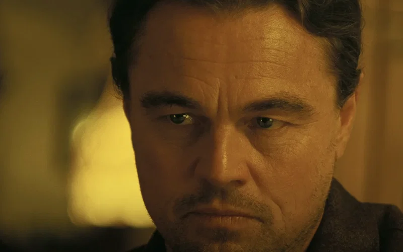 A close-up shot of Leonardo DiCaprio's face in One Battle After Another.