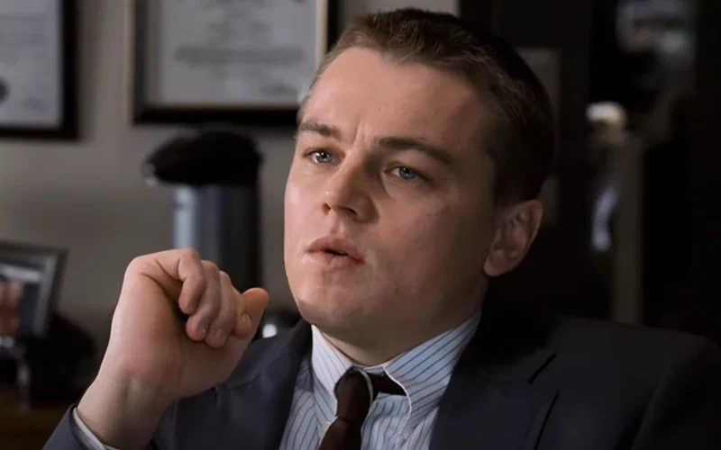 Leonardo DiCaprio wearing a suit and tie in The Departed.
