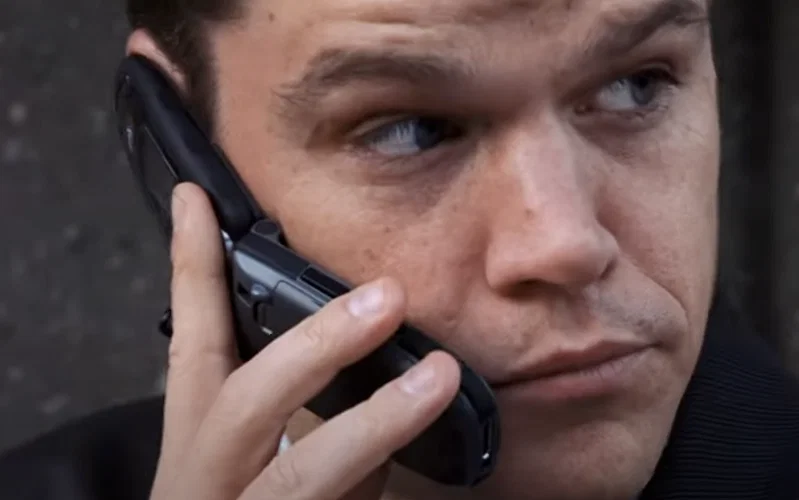 Matt Damon talking on a flip cell phone in The Departed.
