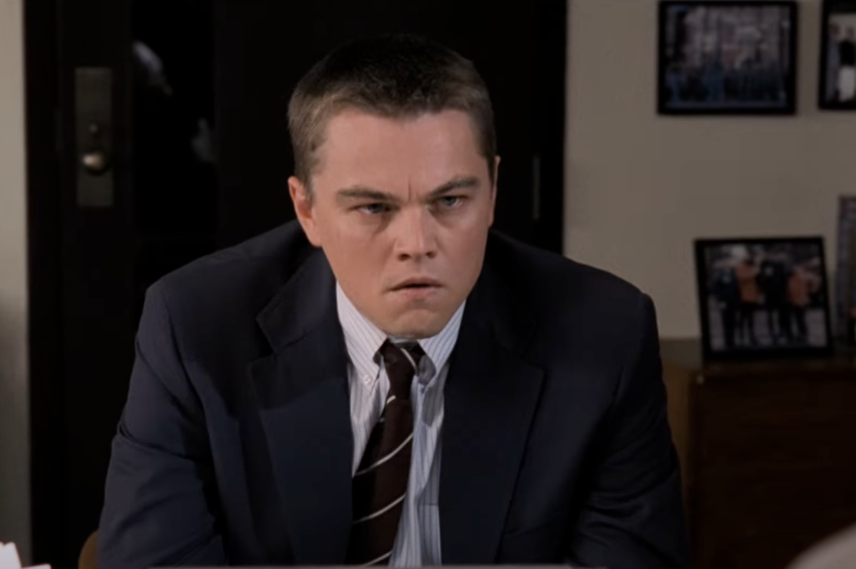 Leonardo DiCaprio wearing a suit and tie in The Departed. 