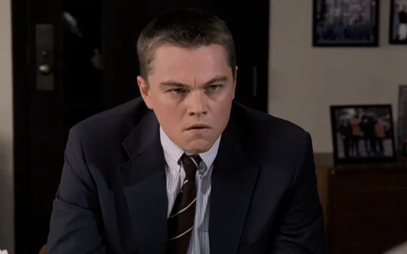 Leonardo DiCaprio wearing a suit and tie in The Departed.