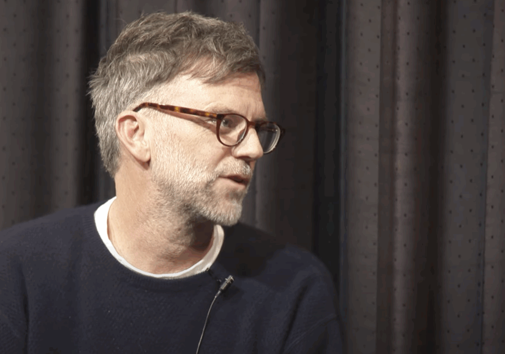 Paul Thomas Anderson wearing a dark, full-sleeved T-shirt. 
