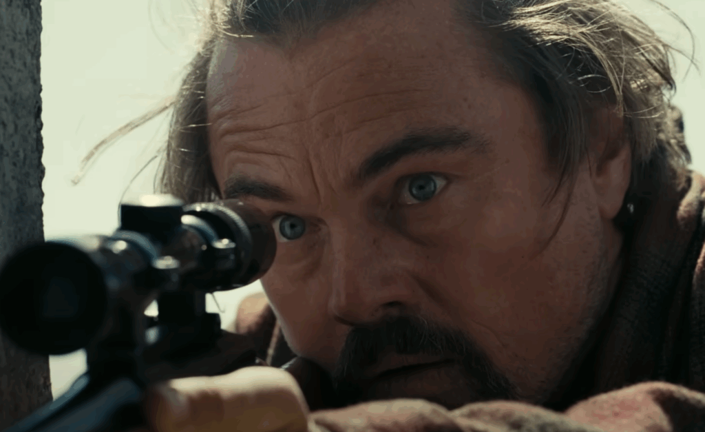 Leonardo DiCaprio's Bob using a sniper in One Battle After Another. 
