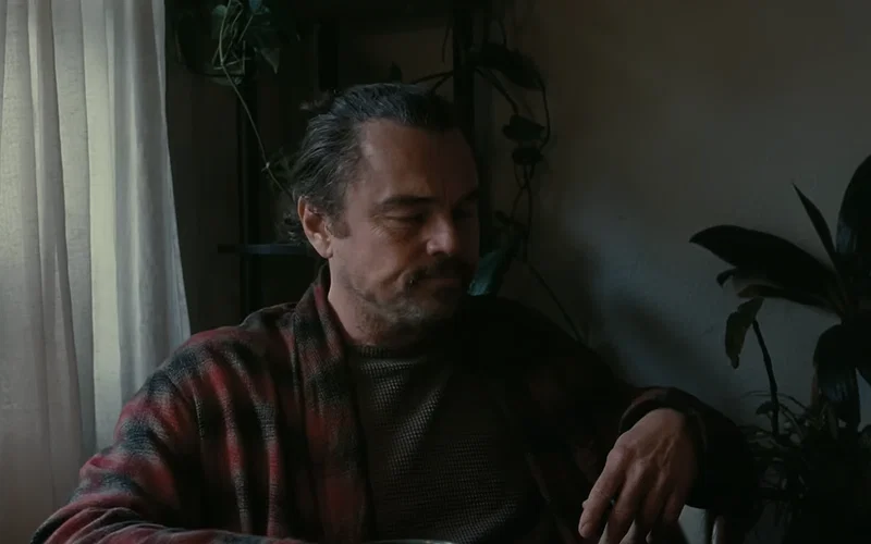 Leonardo DiCaprio's Bob wearing a chequed robe in One Battle After Another.
