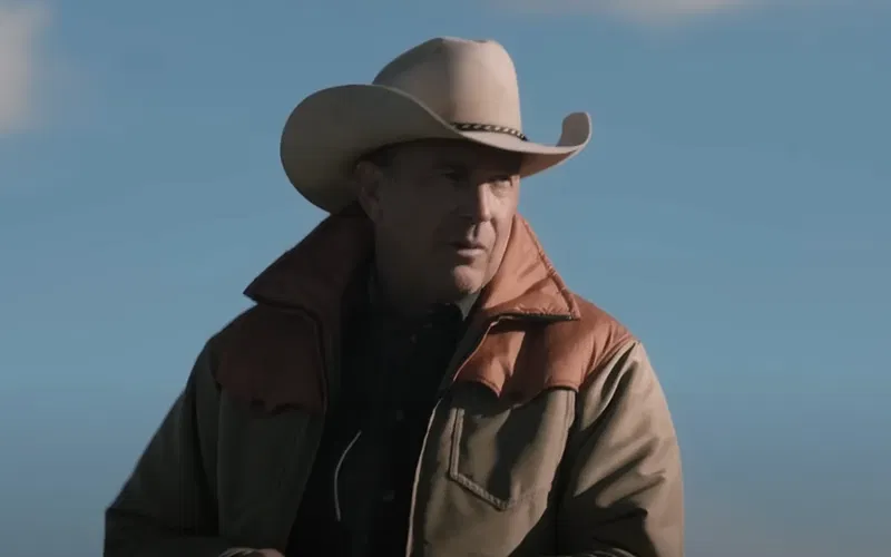 Kevin Costner wearing a cowboy hat and riding a horse in Yellowstone.