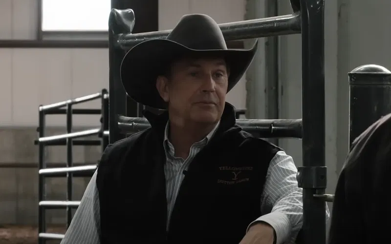 Kevin Costner in a black cowboy hat and vest in Yellowstone.