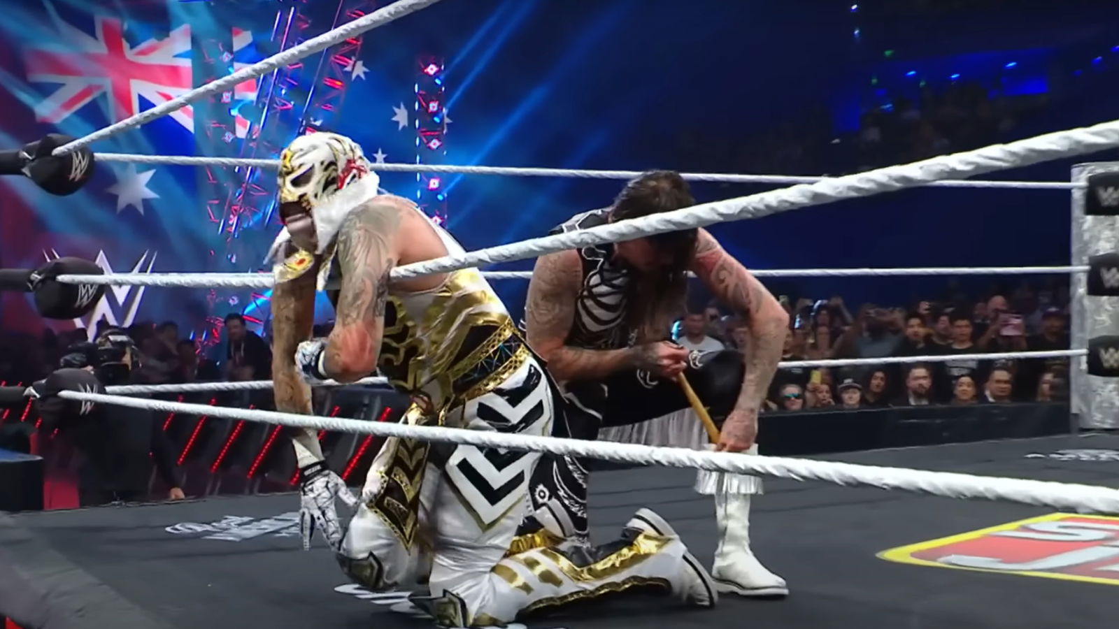 Dominik Mysterio attacking Penta. 