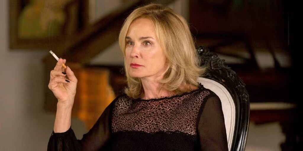 Why Did Jessica Lange Leave the American Horror Story Franchise? Truth Explained 1 Jessica Lange sitting and smoking a cigarette in American Horror Story.